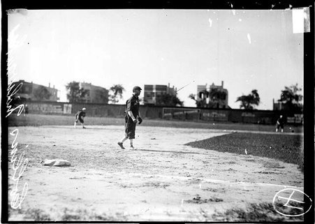 Milwaukee baseball player, Collins, standing near third base on a baseball field - Chicago Daily News, Inc.