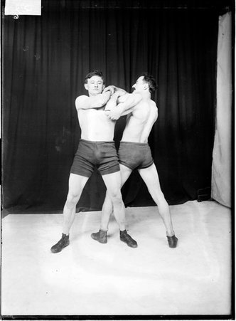 Unidentified wrestler performing a takedown maneuver on another unidentified wrestler - Chicago Daily News, Inc.