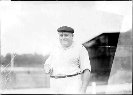 Golfer, H. L. Pound, holding cigar - Chicago Daily News, Inc.