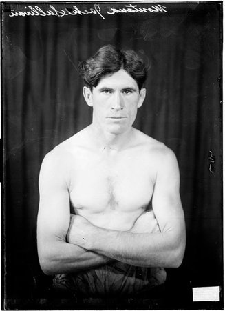 Pugilist, Montana Jack Sullivan, sitting with arms crossed - Chicago Daily News, Inc.