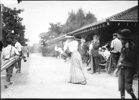 Golfer, Mrs. A. Heaning, standing with golf club on shoulder - Chicago Daily News, Inc.