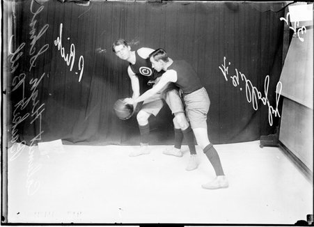 Basketball players, F. Gillogby and I. Rich, Calumet High School - Chicago Daily News, Inc.