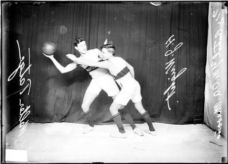 Basketball players H. J. Wright and Walter Tatge, Central YMCA team - Chicago Daily News, Inc.