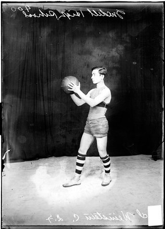 Basketball player, Weinstein, Medill High School, holding basketball - Chicago Daily News, Inc.