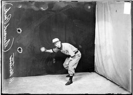 Indoor ball player, H. Morton, Steward Park team, bending forward holding ball - Chicago Daily News, Inc.