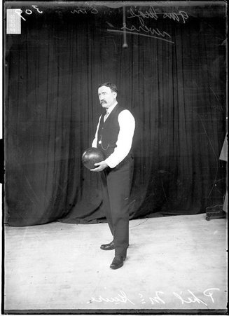 Bowler, Phil McGuire, holding bowling ball with both hands - Chicago Daily News, Inc.