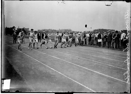 Track and field, All Around Championship, athletes running at start of race at Marshall Field - Chicago Daily News, Inc.