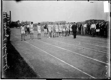 Track and field, All Around Championship, athletes standing on track for start of race at Marshall Field - Chicago Daily News, Inc.