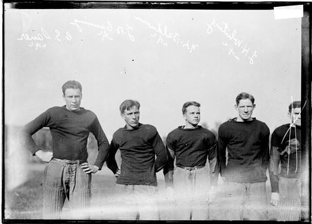 Football players, Sauer, J. B. Canning, Baldwin, and L. H. Whiting standing on grass at Marshall Field, U. of C. - Chicago Daily News, Inc.