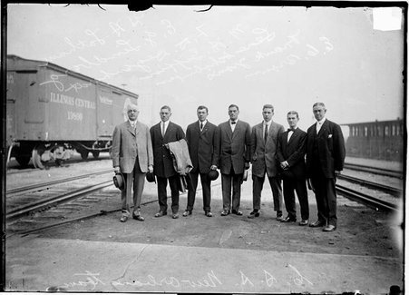 Athletes,New Orleans team standing on ground between railroad tracks, Chicago Athletic Assn. - Chicago Daily News, Inc.
