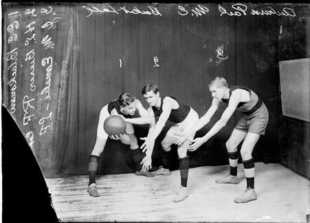 Auburn Park Methodist Episcopal Church basketball players posing with Blackman, guarded by Bierer, preparing to pass the ball to Emslie - Chicago Daily News, Inc.