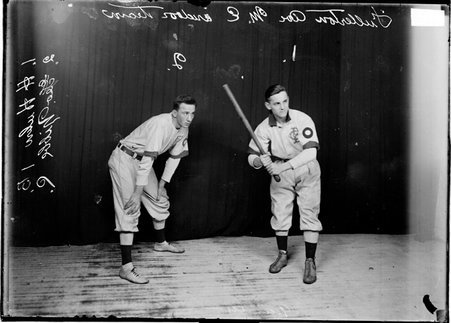 Fullerton Avenue Methodist Episcopal Church indoor baseball players posing with Huhn batting Nibbe catching - Chicago Daily News, Inc.