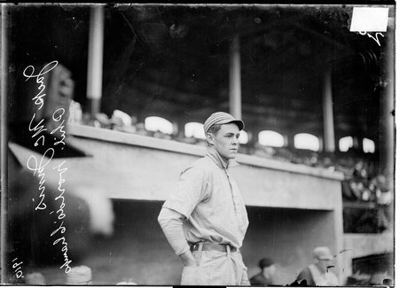 Baseball player, Jack McJunis standing near dugout at Shibe Park - Chicago Daily News, Inc.