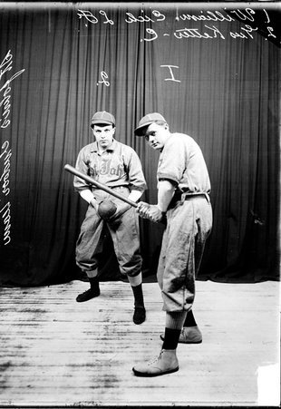 St. John's Athletic Club indoor baseball players posing with Williams batting and Ketter standing behind him holding a ball - Chicago Daily News, Inc.