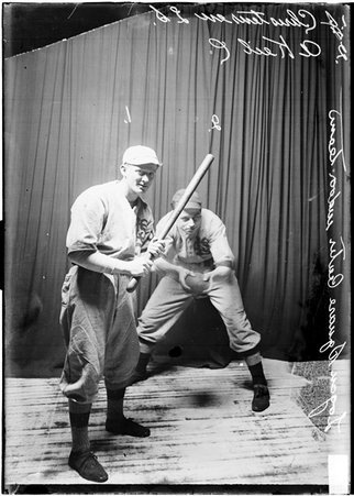 Logan Square Center indoor baseball players posing with Christensen holding a bat and Keil standing behind him holding a ball - Chicago Daily News, Inc.