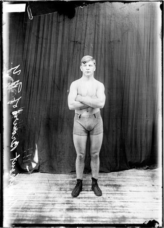 Pugilist, Knockout Brown of New York, with his arms crossed - Chicago Daily News, Inc.