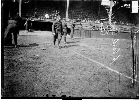 Baseball player, C. Griffith of the Cincinnati Reds walking on the field - Chicago Daily News, Inc.