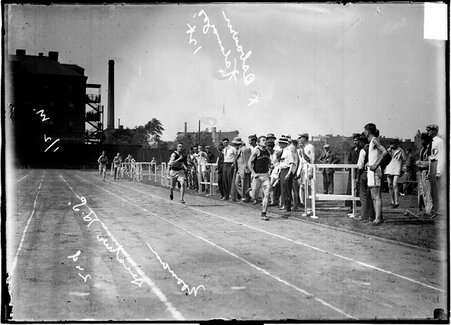 Kalamazoo, Michigan, athlete Osborn, in first place, and Decatur High School athlete Noonan, in second place, running across finish line - Chicago Daily News, Inc.