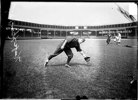 National League's Cincinnati Reds baseball player Keefe bending to the side to catch a ball at West Side Grounds - Chicago Daily News, Inc.