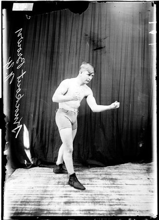 Pugilist, Knockout Brown of New York, in stance with left shoulder down - Chicago Daily News, Inc.