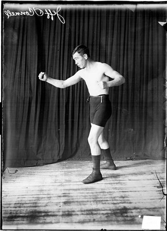 Boxer Jeff O'Connell in a boxing stance, facing left - Chicago Daily News, Inc.