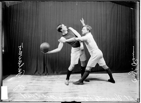 St. Vincent's Lycieum basketball players posing with Galavan holding the ball and Ram guarding him - Chicago Daily News, Inc.