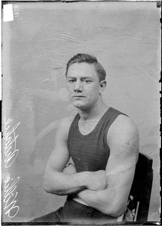 Pugilist, Willie Ritchie, sitting in front of a light-colored backdrop - Chicago Daily News, Inc.
