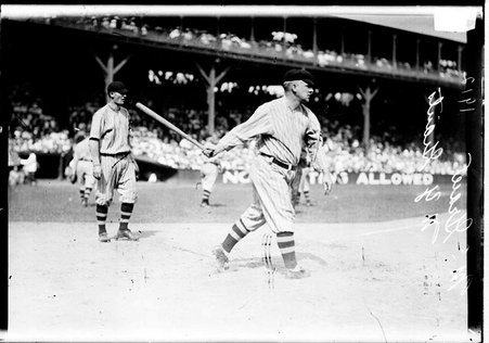 Baseball player, John McGraw, New York Giants, bat in right hand, following through on a swing - Chicago Daily News, Inc.