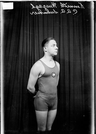 Swimmer, Kenneth Huszagh, C. A. A., standing and looking to his left - Chicago Daily News, Inc.