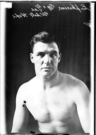 Pugilist, Ephreim McGee, sitting in a room - Chicago Daily News, Inc.