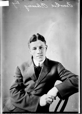 Pugilist, Frankie Fleming sitting in a chair, with his hands clasp in front of him - Chicago Daily News, Inc.