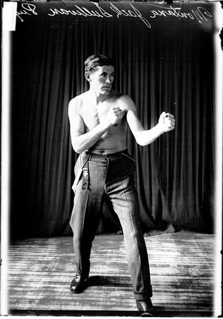 Pugilist, Montana Jack, standing in a boxing stance turned slightly to the image right - Chicago Daily News, Inc.