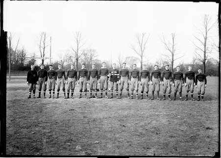 Football team, Hyde Park High School seventeen members standing on an athletic field - Chicago Daily News, Inc.