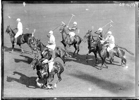 Polo, East-West match, six polo players, mallets raised, riding in a tight group - Chicago Daily News, Inc.