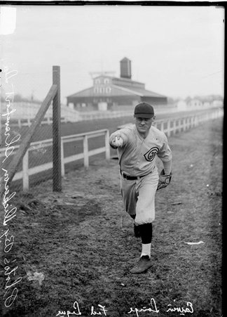 Baseball player, Erwin Lange, Chicago Whales, posing by a racetrack fence - Chicago Daily News, Inc.