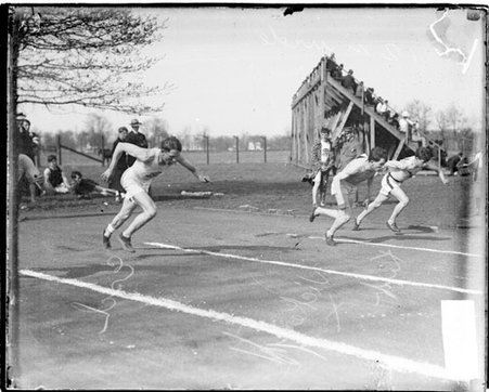 Athletes Vickery, Esch, and Hipp racing on an athletic track - Chicago Daily News, Inc.