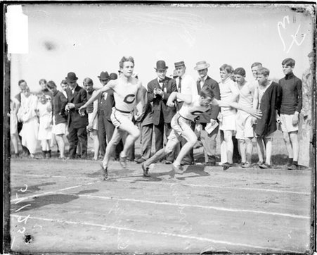 University of Chicago athletes, Merriam and Quigley, racing on an athletic track - Chicago Daily News, Inc.