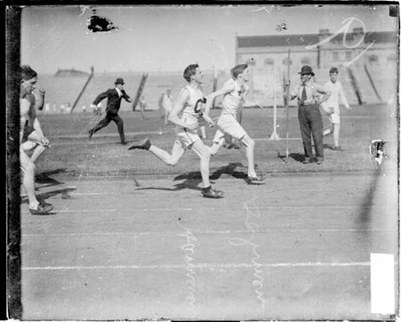 Athletes, Dohmen running ahead of Hannenen, in a race at Marshall Field at the University of Chicago in the Hyde Park community area - Chicago Daily News, Inc.