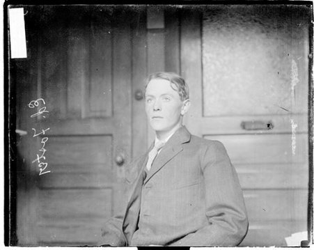 Ed Foster sitting in a room at the Chicago Daily News building - Chicago Daily News, Inc.