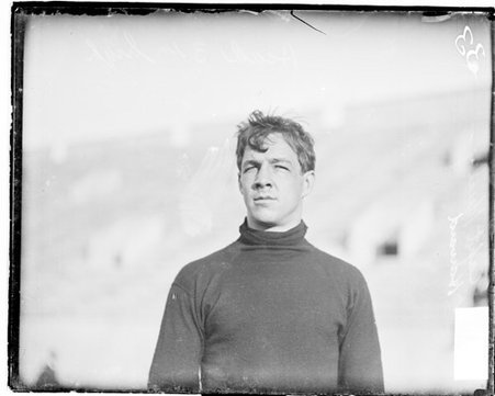 Harvard University football team captain Hurley, standing outdoors - Chicago Daily News, Inc.