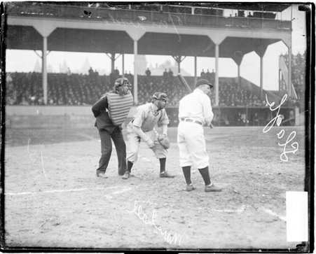 Jimmy Slagle, Chicago Cubs, batting, with catcher Doc Marshall, St. Louis Cardinal, crouching behind home plate, and umpire Johnstone officiating during a National League game at West Side Grounds - Chicago Daily News, Inc.