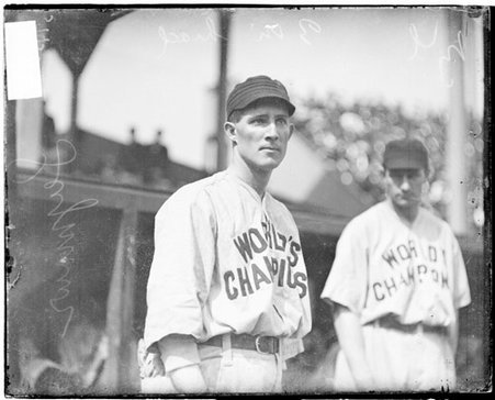 New York Giants baseball player, Cy Seymour, standing in front of a dugout at West Side Grounds, in the Near West Side community area - Chicago Daily News, Inc.