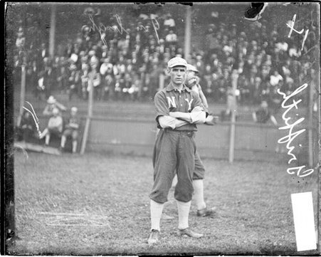 Clark Griffith, manager, New York Highlanders, standing in front of the grandstands on the field at South Side Park - Chicago Daily News, Inc.