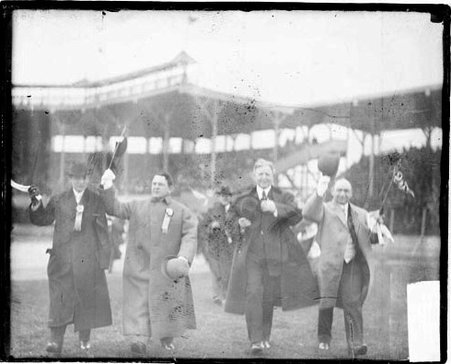 Charles Comiskey, owner of the White Sox, and 3 other men walking on the field - Chicago Daily News, Inc.