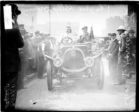 Eugene Kelly and Charles R. Horries, automobile drivers, driving along a street - Chicago Daily News, Inc.