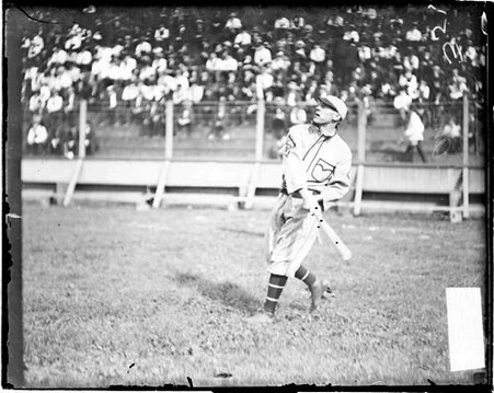 Baseball player Koehler of St. Louis baseball team, looking up and holding a baseball bat - Chicago Daily News, Inc.