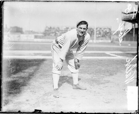 Baseball player, Walsh, White Sox, leaning over with his hands on his knees in foul territory on the field at South Side Park - Chicago Daily News, Inc.