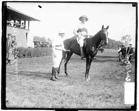 Polo player Sewart Carey sitting in a saddle atop a horse on the grounds at Onwentsia Club - Chicago Daily News, Inc.
