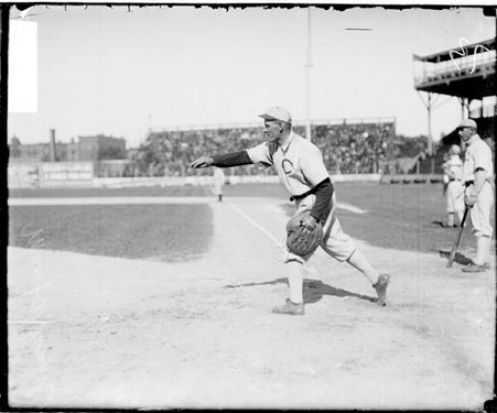Baseball player, McFarland, White Sox, following through after throwing a baseball towards third base at South Side Park - Chicago Daily News, Inc.