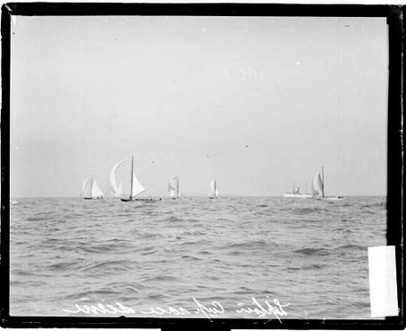 Yachts sailing on Lake Michigan during the Lipton Cup Yacht Race, with a steamship in background - Chicago Daily News, Inc.